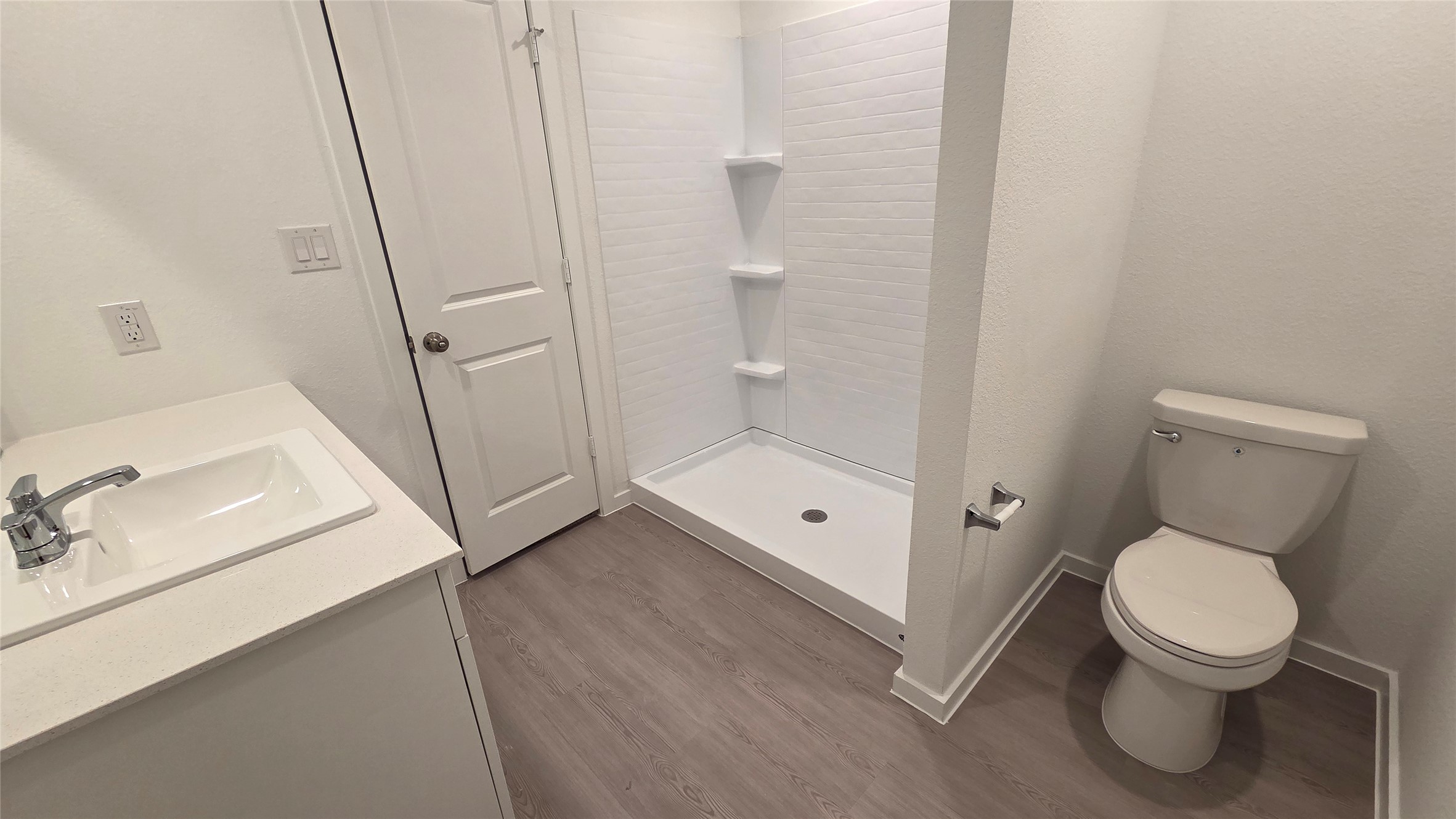 110 Canadian Cove Kyle, TX 78640 - Photo 9 of 20 a white toilet sitting next to a bathroom sink