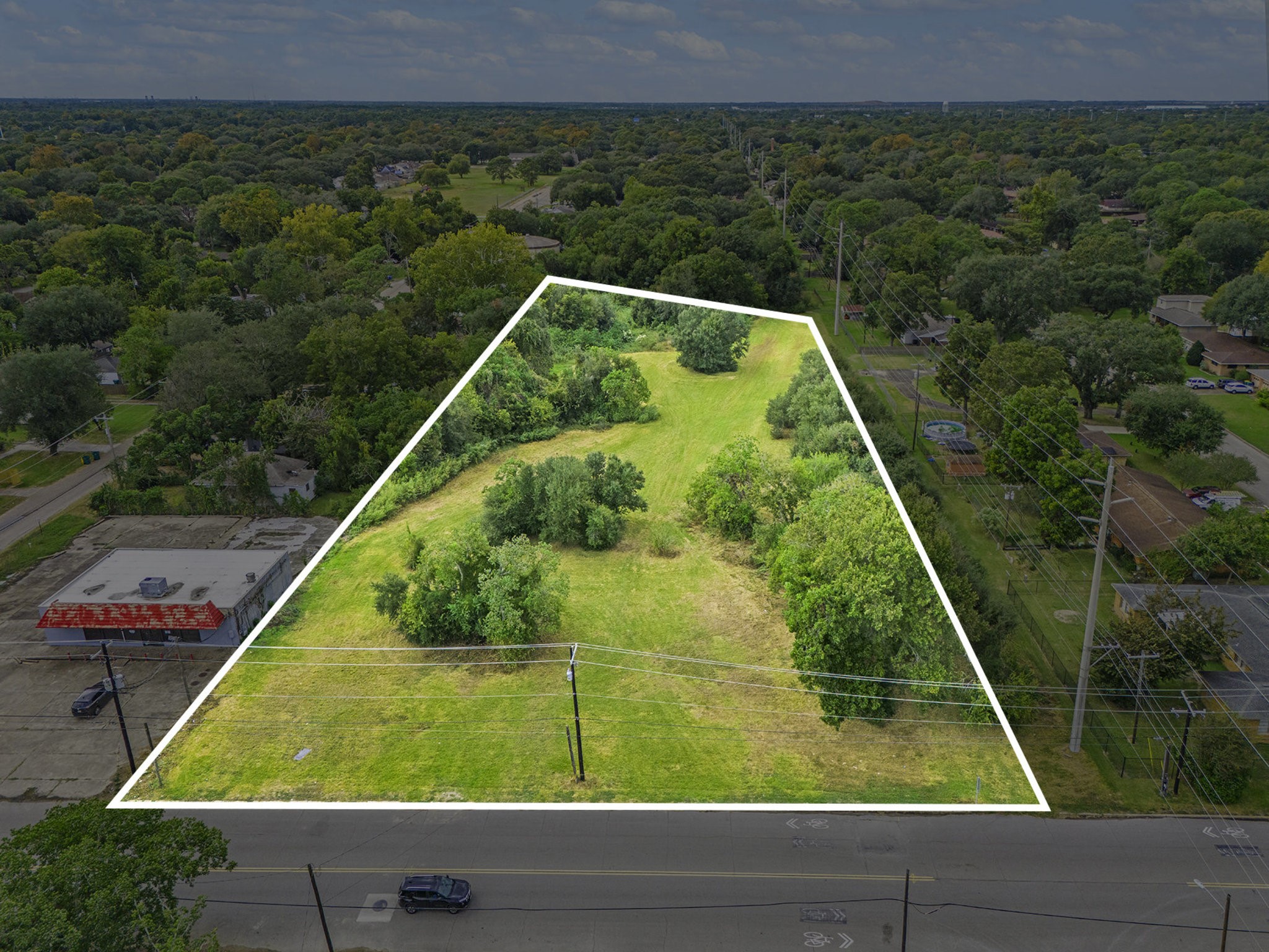 0 Bayou Road La Marque, TX 77568 - Photo 2 of 9 a view of a yard with potted plants