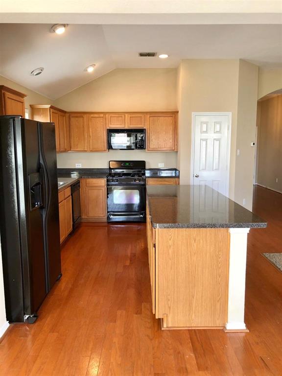 1021 Terrace View Drive Fort Worth, TX 76108 - Photo 11 of 22 a kitchen with stainless steel appliances granite countertop a refrigerator a stove and a sink