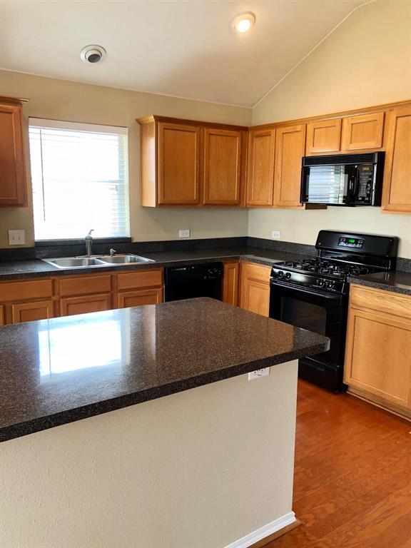 1021 Terrace View Drive Fort Worth, TX 76108 - Photo 12 of 22 a kitchen with stainless steel appliances granite countertop a stove a sink and a microwave