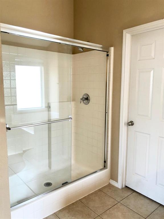 1021 Terrace View Drive Fort Worth, TX 76108 - Photo 16 of 22 a bathroom with a glass shower door