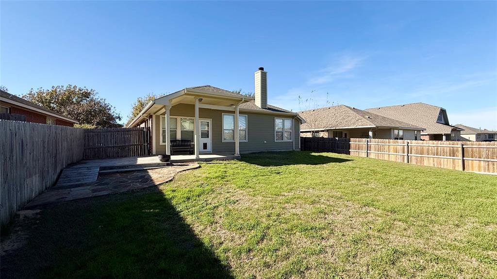 1021 Terrace View Drive Fort Worth, TX 76108 - Photo 20 of 22 a front view of a house with a garden