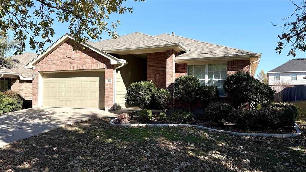 1021 Terrace View Drive Fort Worth, TX 76108 - Photo 2 of 22 a front view of a house with a yard and garage