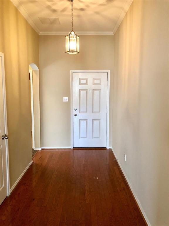 1021 Terrace View Drive Fort Worth, TX 76108 - Photo 4 of 22 a view of an empty room with window wooden floor and kitchen view