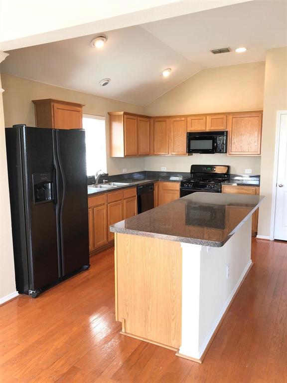 1021 Terrace View Drive Fort Worth, TX 76108 - Photo 10 of 22 a kitchen with stainless steel appliances granite countertop a refrigerator a sink a stove a microwave and island
