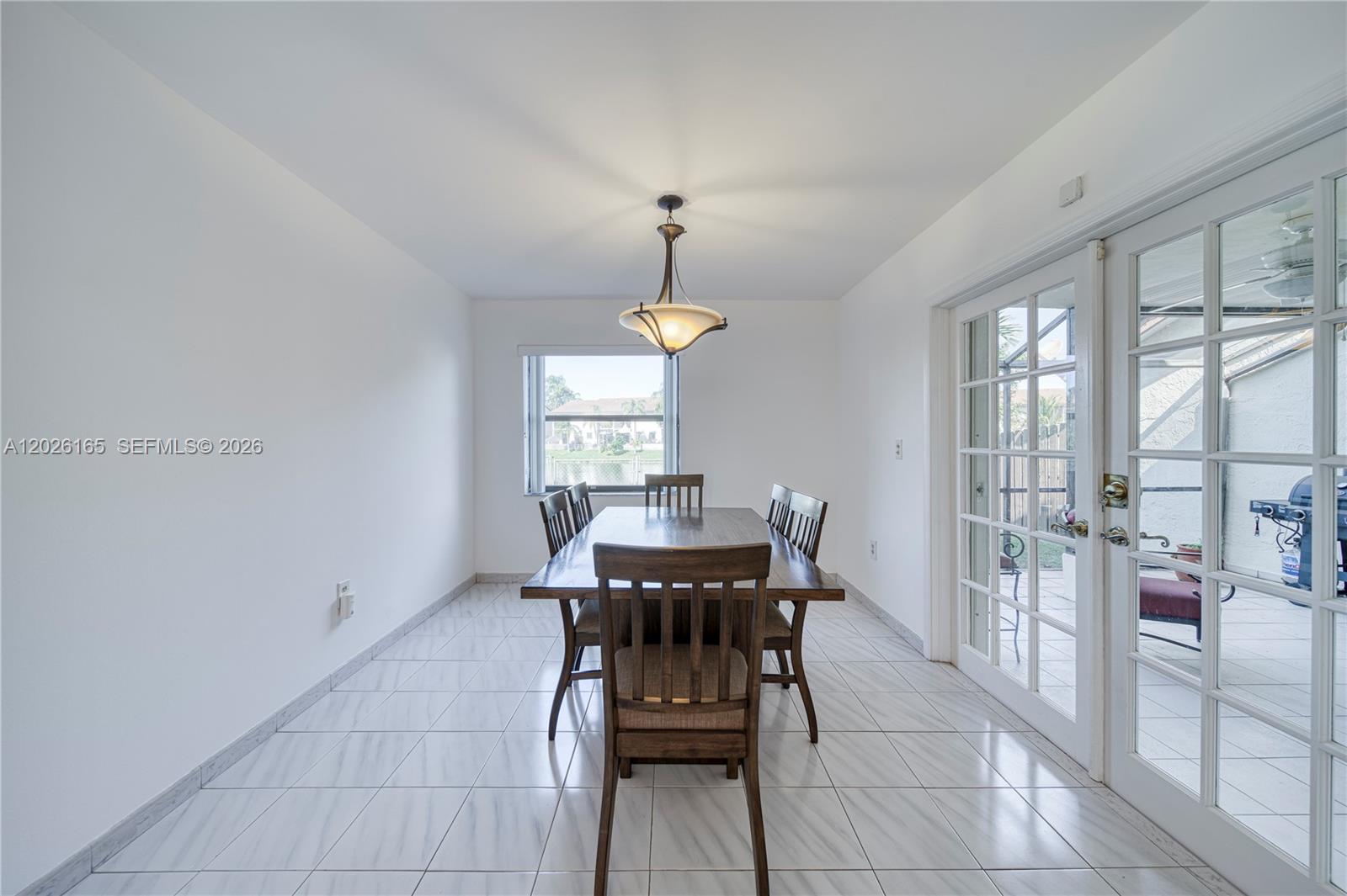 13337 Southwest 64th Lane Miami, FL 33183 - Photo 8 of 36 a dining room with furniture and window
