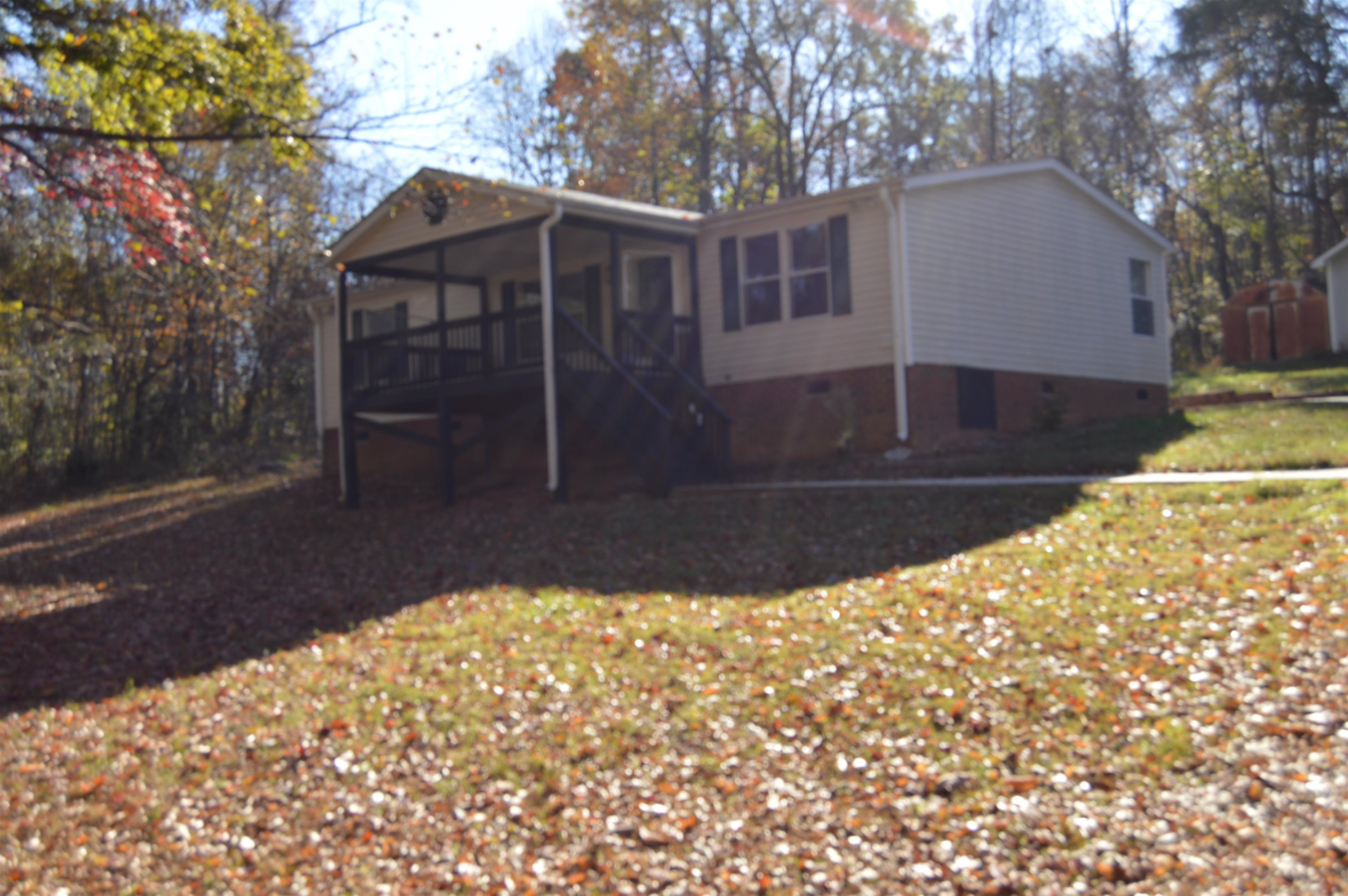 879 Holeman Ashley Road Timberlake, NC 27583 - Photo 1 of 9 a view of a house with a yard