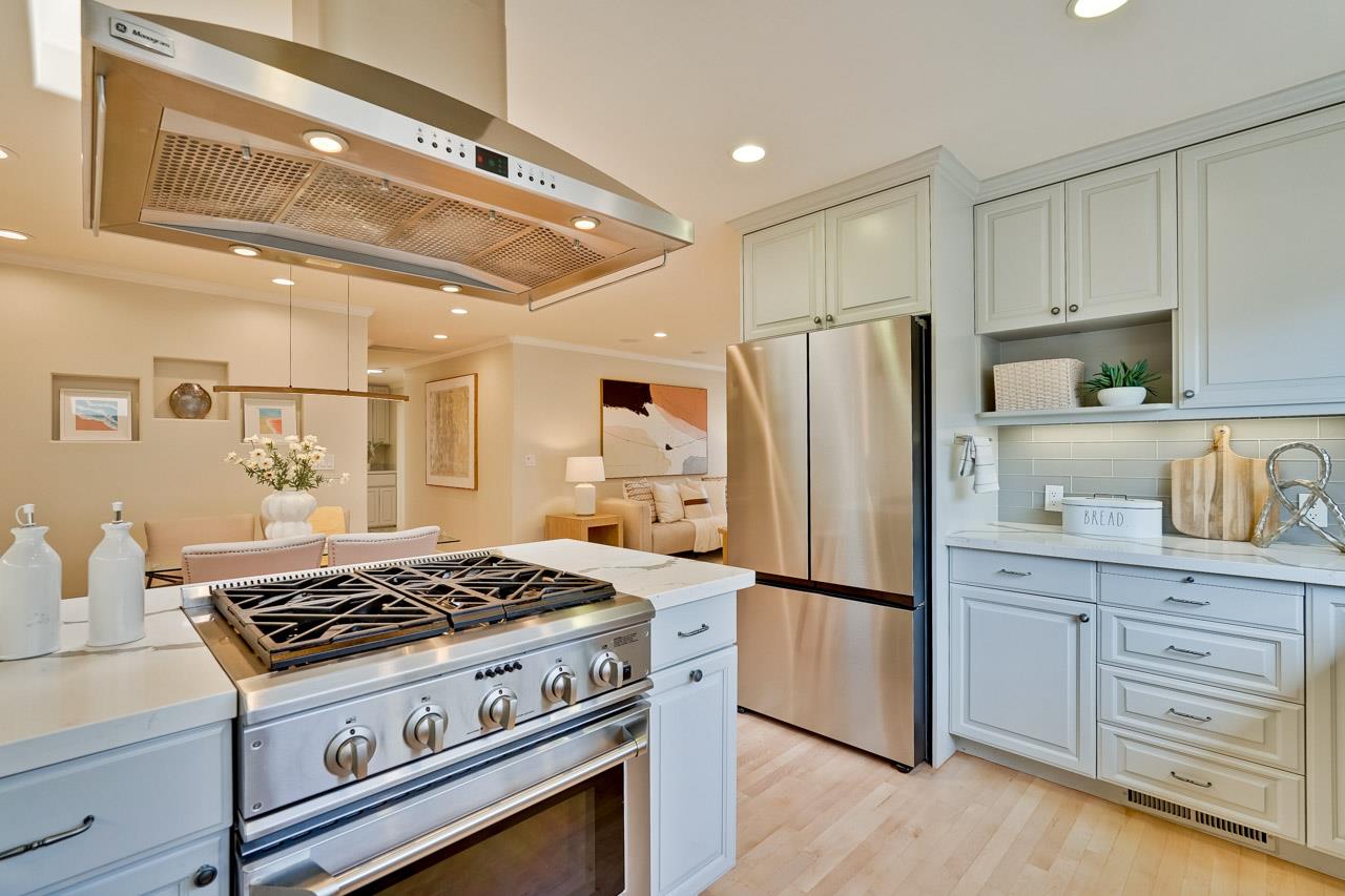 891 Humewick Way Sunnyvale, CA 94087 - Photo 15 of 45 a kitchen with stainless steel appliances granite countertop a stove a refrigerator and a refrigerator