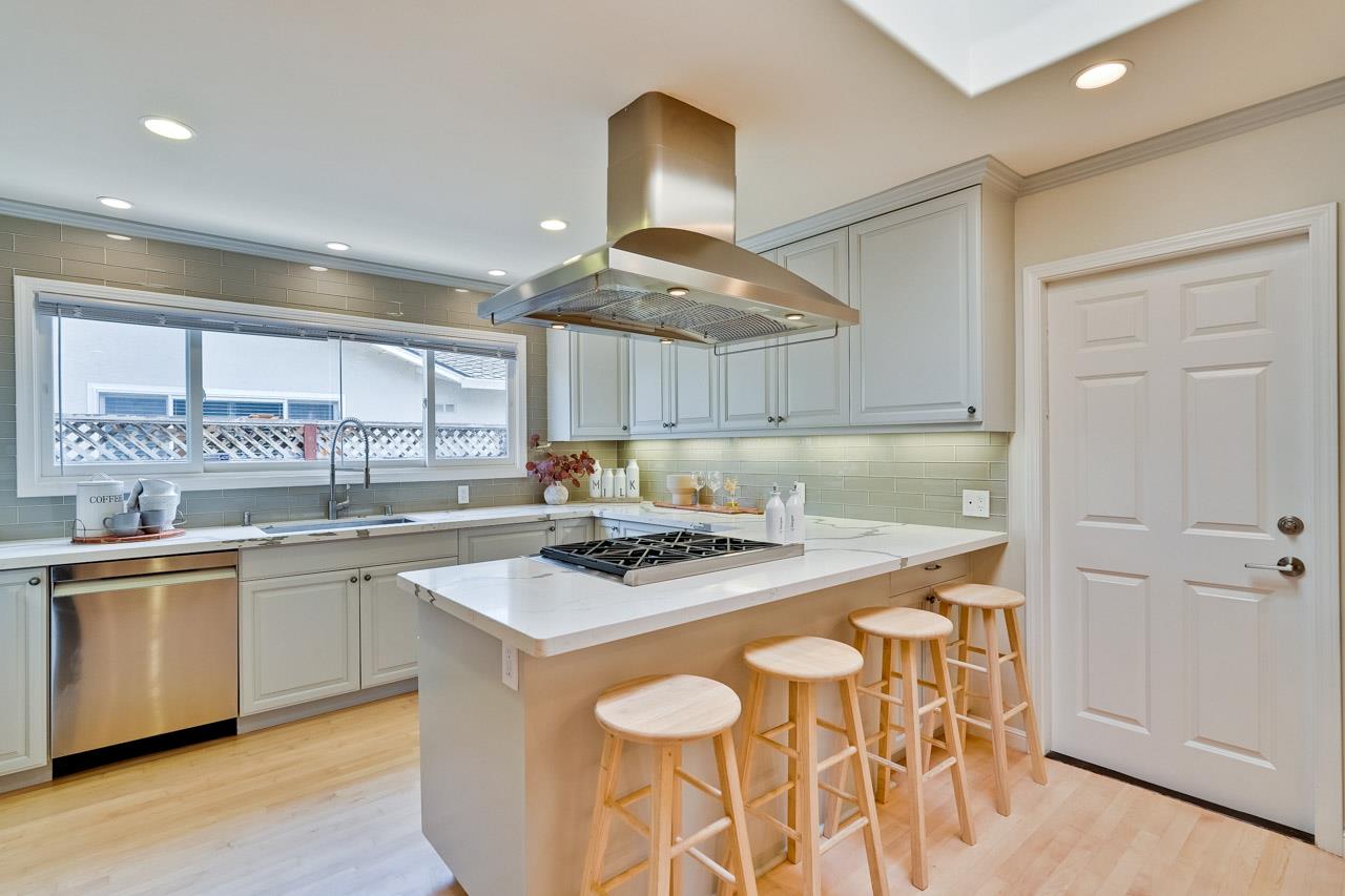891 Humewick Way Sunnyvale, CA 94087 - Photo 16 of 45 a kitchen with stainless steel appliances granite countertop a sink a stove and a refrigerator