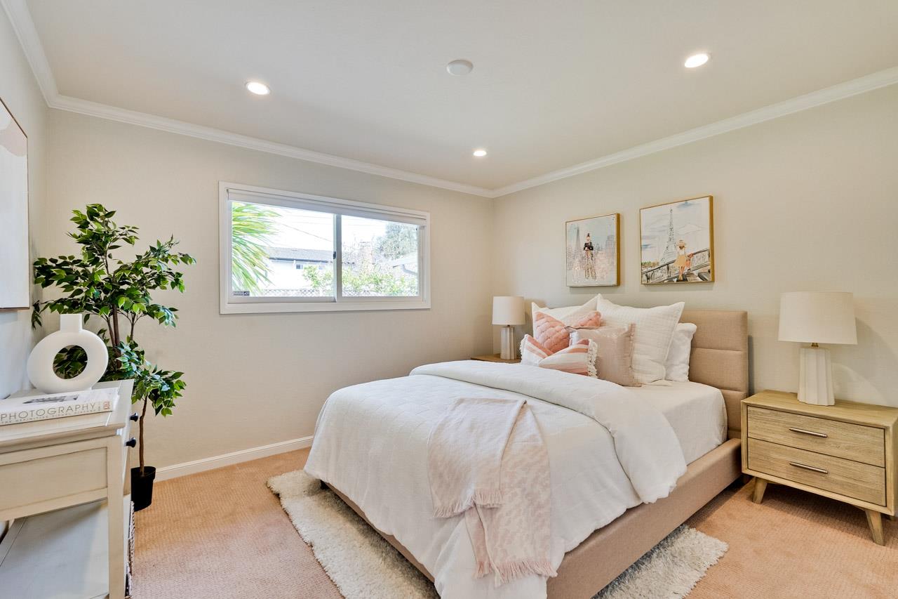 891 Humewick Way Sunnyvale, CA 94087 - Photo 24 of 45 a bedroom with a bed and a plant