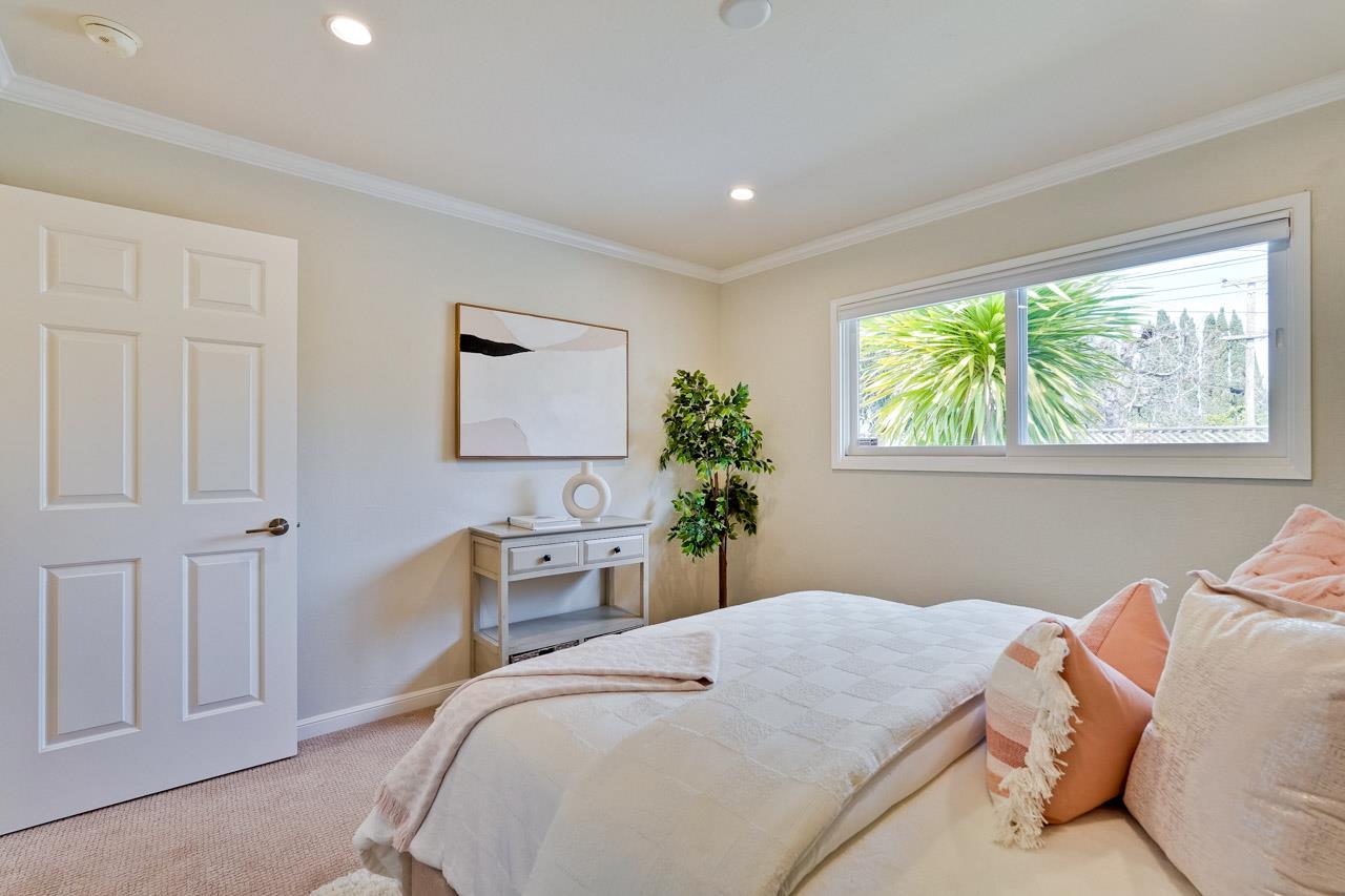 891 Humewick Way Sunnyvale, CA 94087 - Photo 26 of 45 a bedroom with a bed and a potted plant