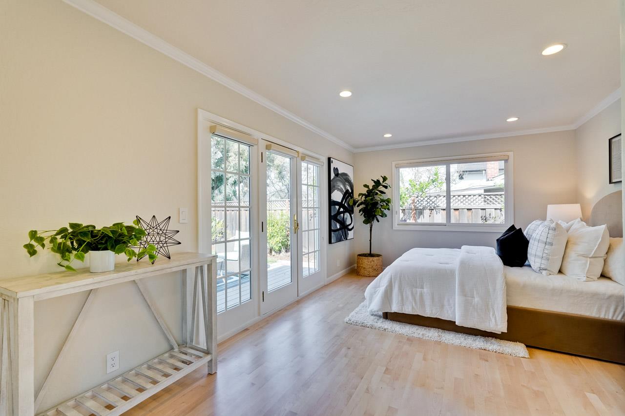 891 Humewick Way Sunnyvale, CA 94087 - Photo 28 of 45 a bedroom with a bed and large window