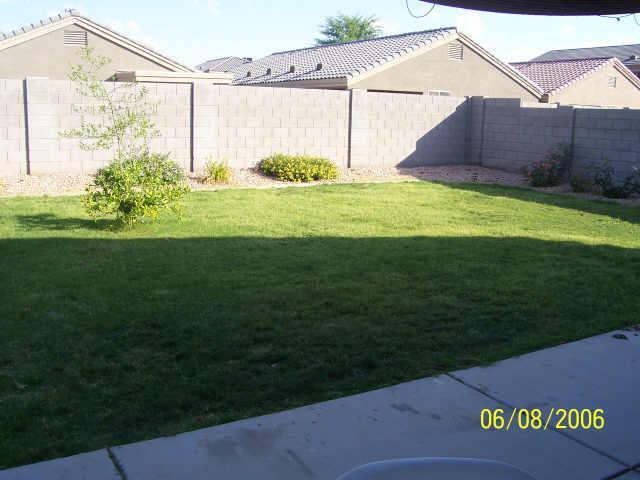 a view of a back yard of the house
