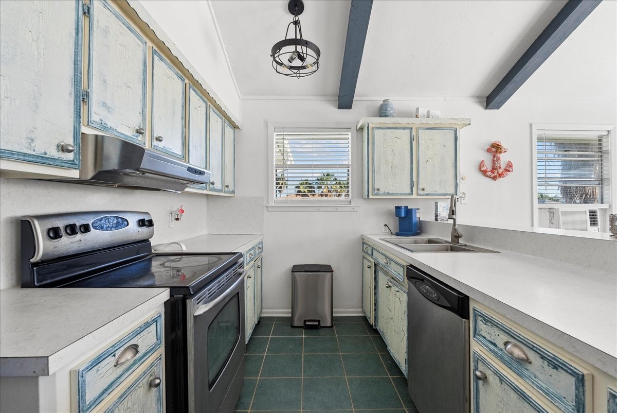 324 Shark Lane Surfside Beach, TX 77541 - Photo 18 of 49 The kitchen is open to the living area.