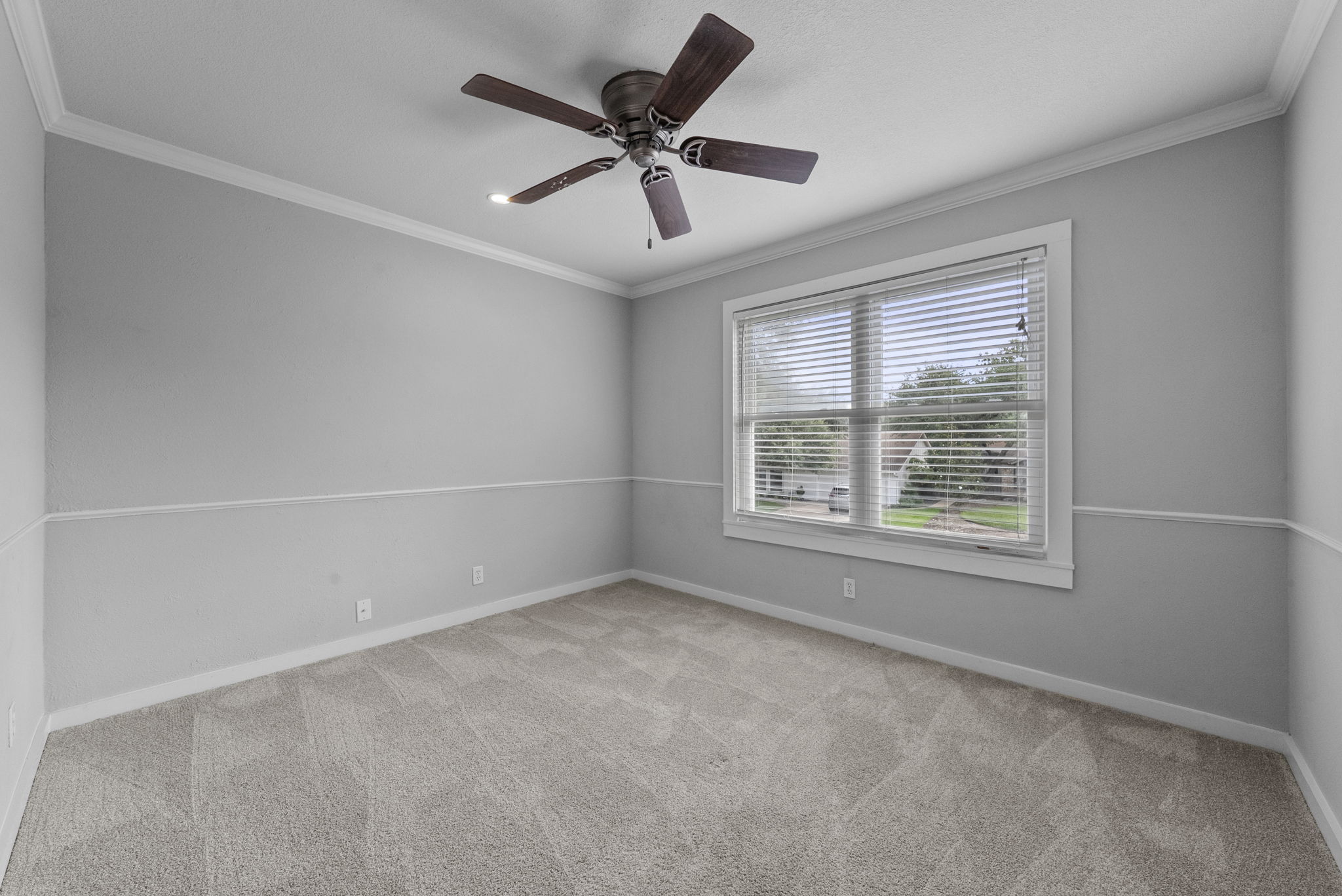 11405 Pyreneese Drive Austin, TX 78759 - Photo 22 of 37 an empty room with a window and a fan