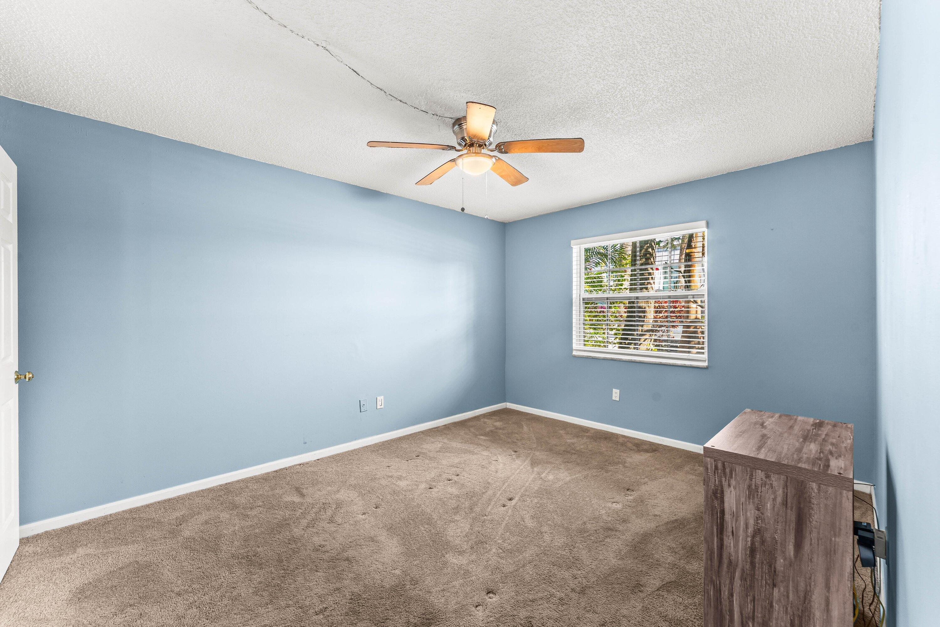 950 South Kanner Highway, Unit C10 Stuart, FL 34994 - Photo 15 of 31 an empty room with windows and fan