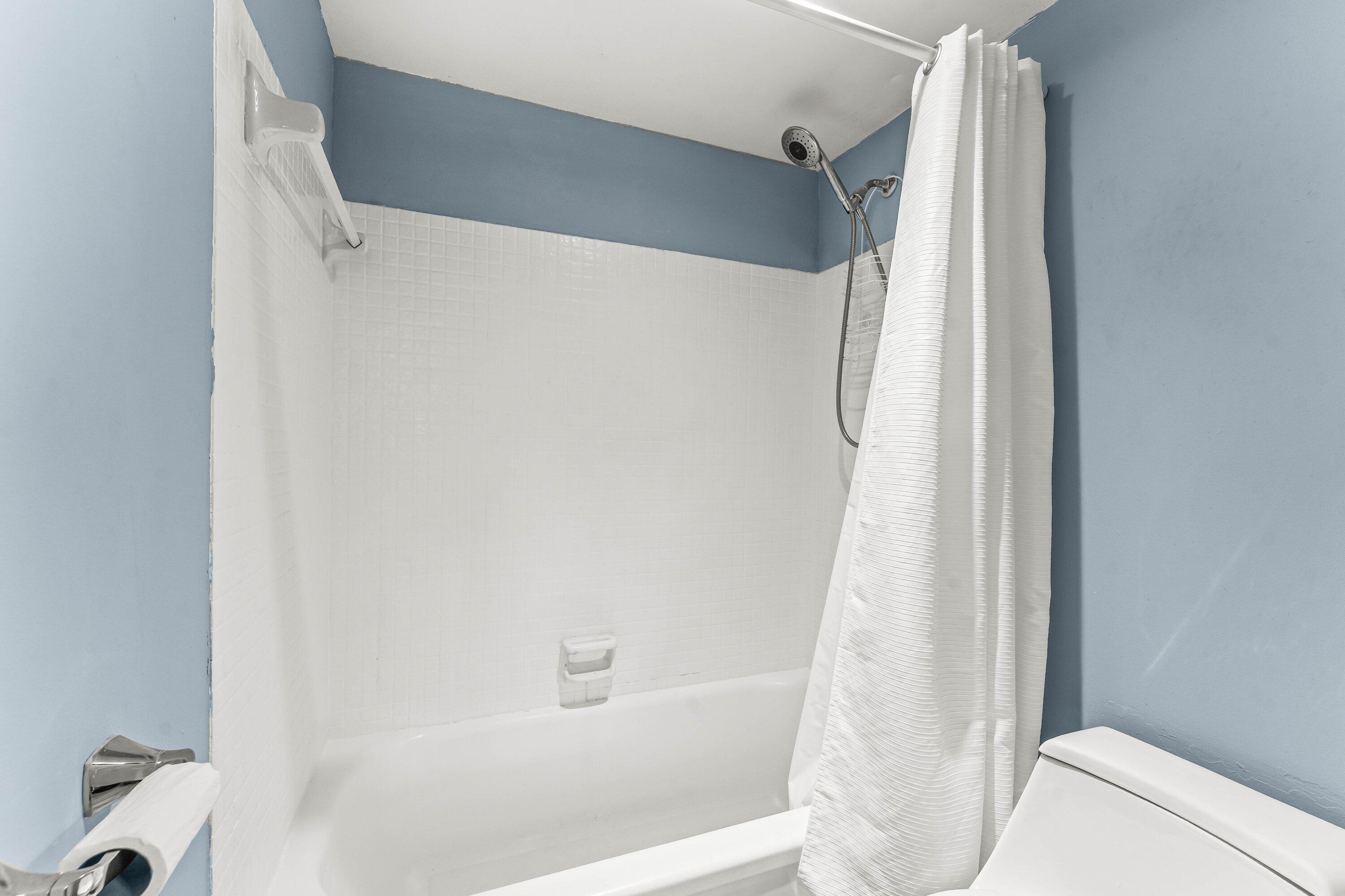 950 South Kanner Highway, Unit C10 Stuart, FL 34994 - Photo 17 of 31 a bathroom with a bathtub and a shower