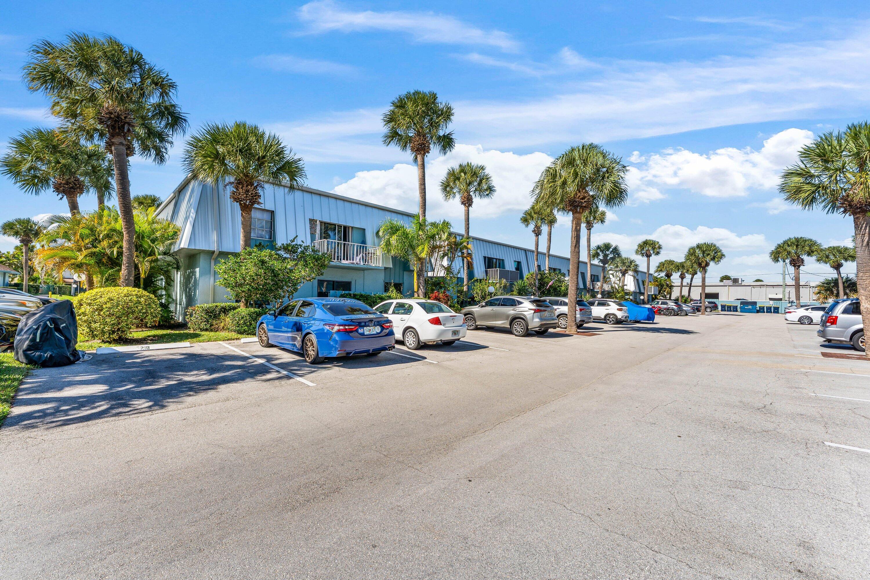 950 South Kanner Highway, Unit C10 Stuart, FL 34994 - Photo 2 of 31 a view of road with card parked on side and retail shops