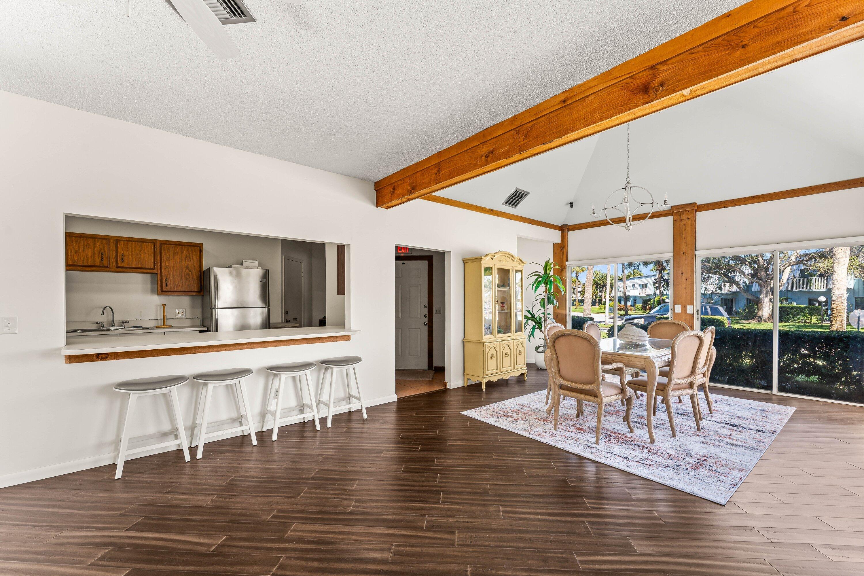 950 South Kanner Highway, Unit C10 Stuart, FL 34994 - Photo 29 of 31 a dining room with furniture window and wooden floor