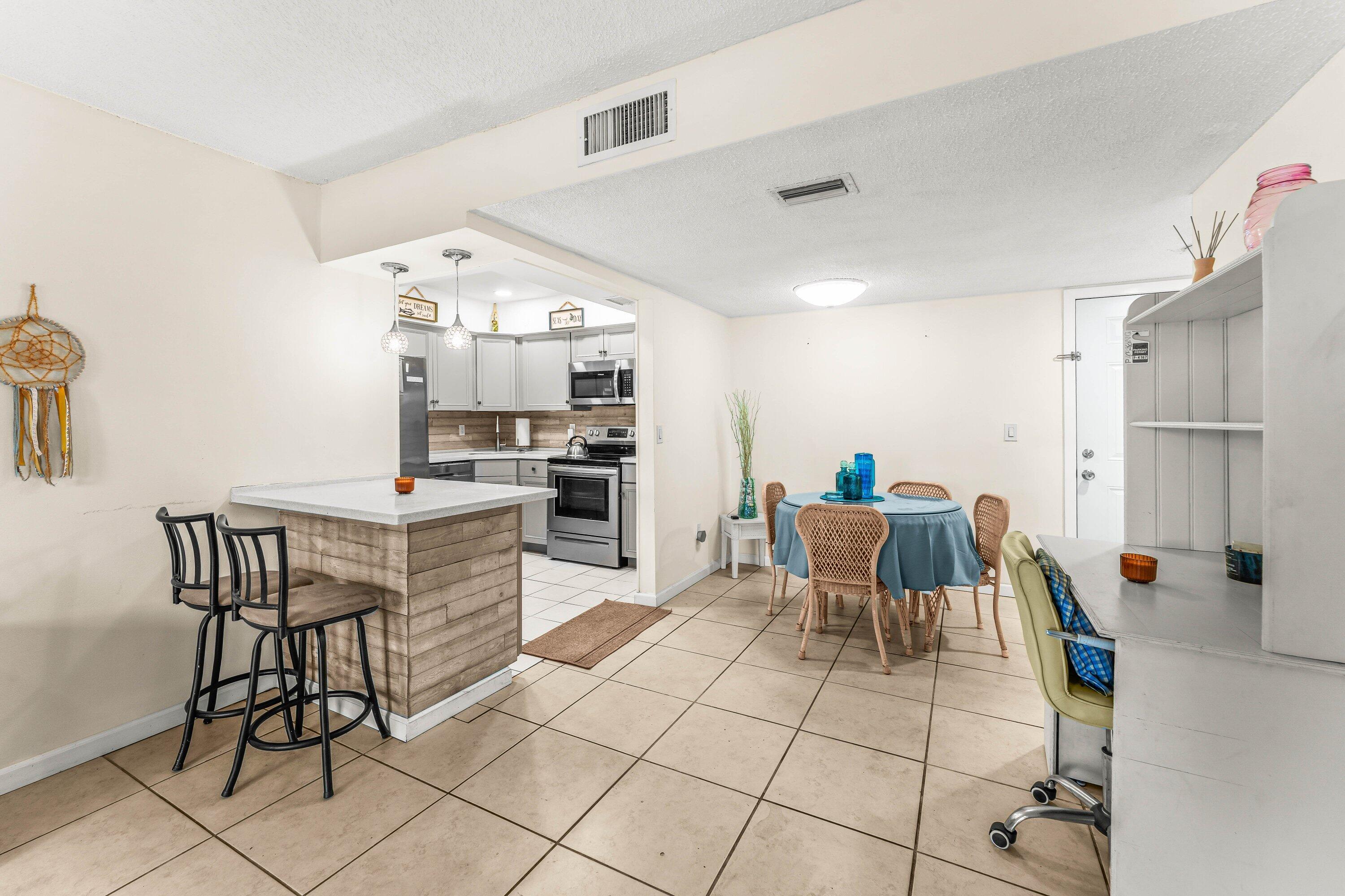 950 South Kanner Highway, Unit C10 Stuart, FL 34994 - Photo 8 of 31 a view of a dining room with furniture
