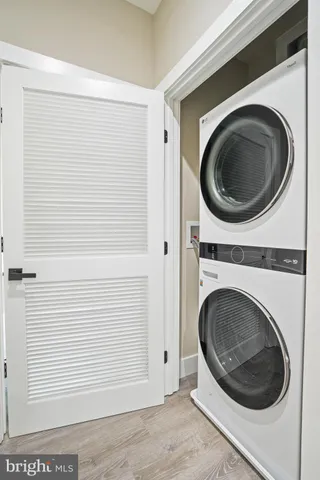 a view of a hallway with washer and dryer