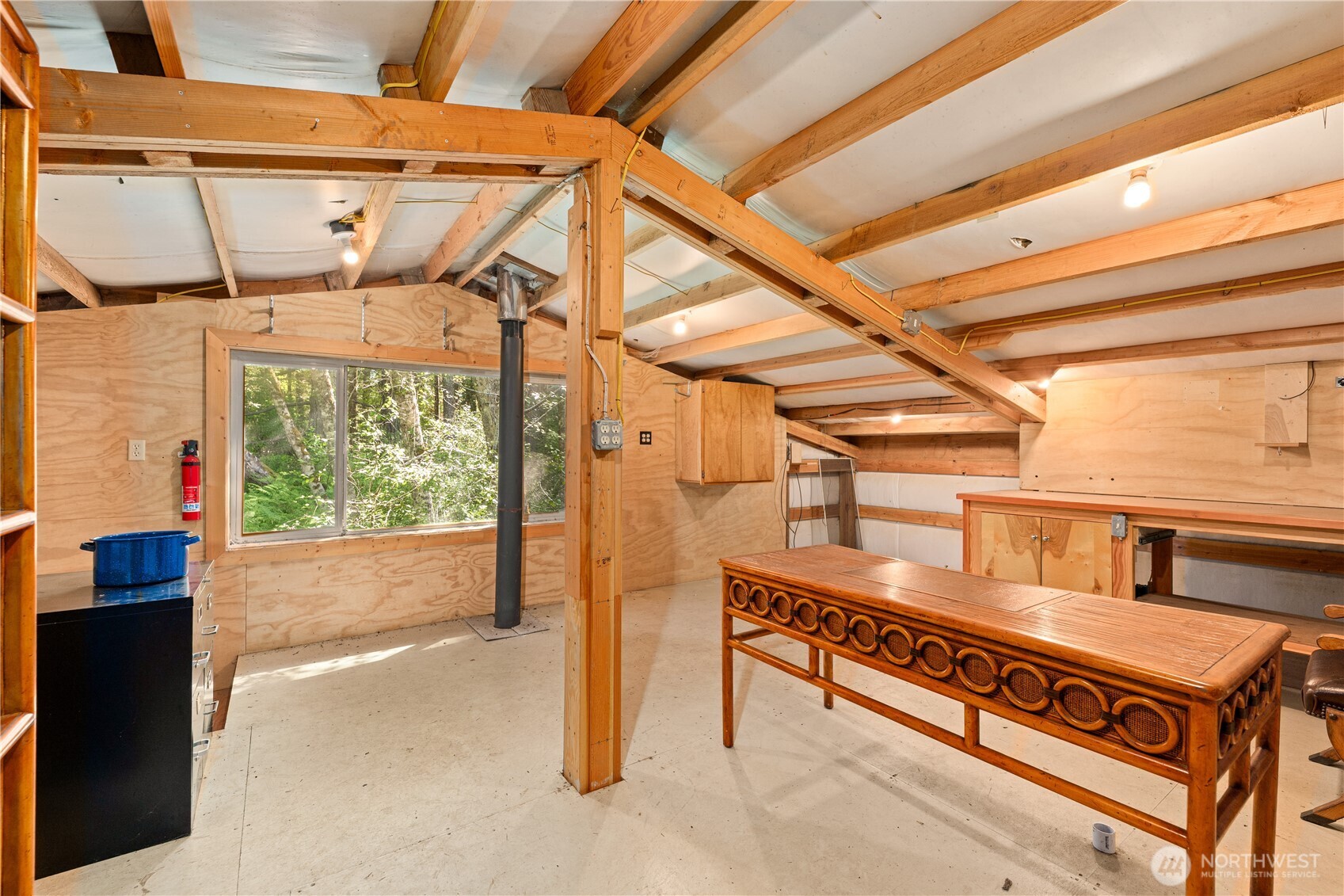 134 Sacred Moon Way Friday Harbor, WA 98250 - Photo 32 of 35 a view of a patio with table and chairs with wooden floor