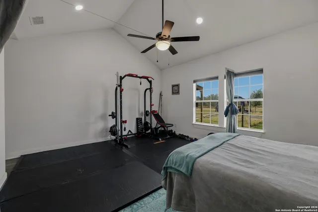 a bed room with a bed and a chandelier