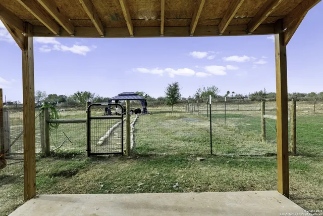 a view of a porch with a big yard