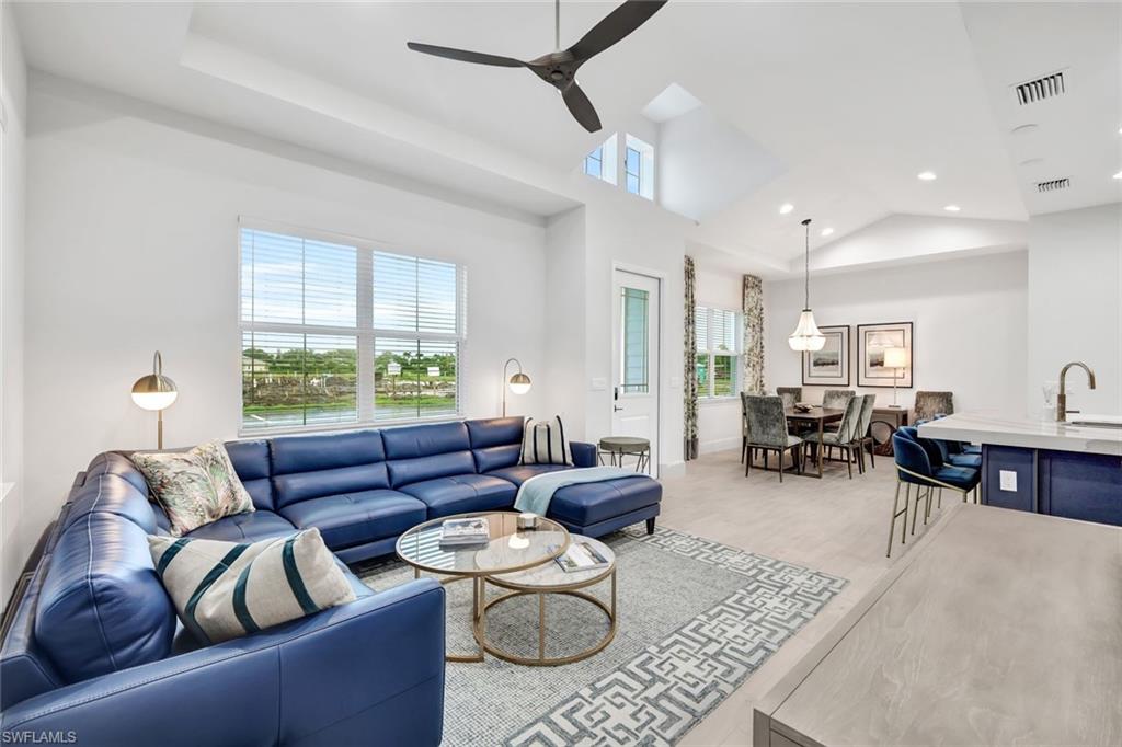 7142 Cayo Coco Lane Naples, FL 34113 - Photo 3 of 17 a living room with furniture and a large window