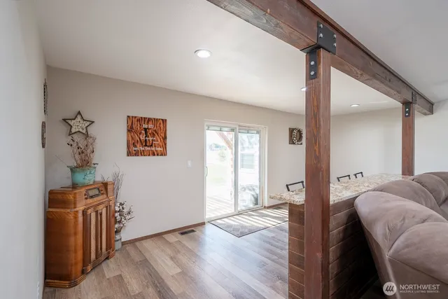 a view of a bedroom with furniture and windows