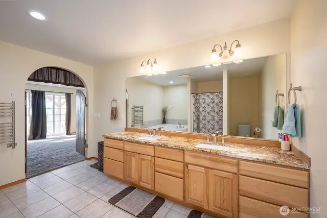 a bathroom with a granite countertop sink a mirror and a