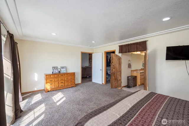 a bedroom with furniture and a window