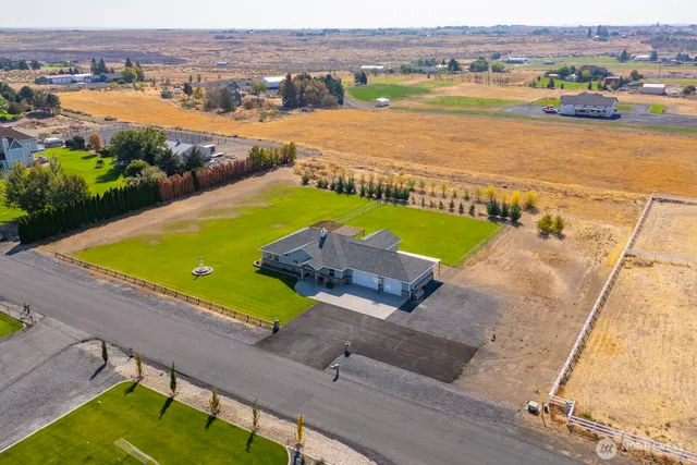 an aerial view of a house with a lake view