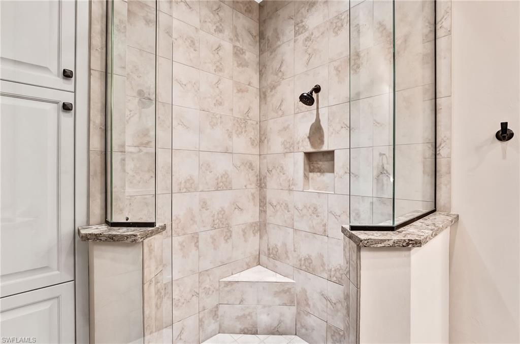 7002 Dominica Drive Naples, FL 34113 - Photo 27 of 45 Bathroom with a tile shower