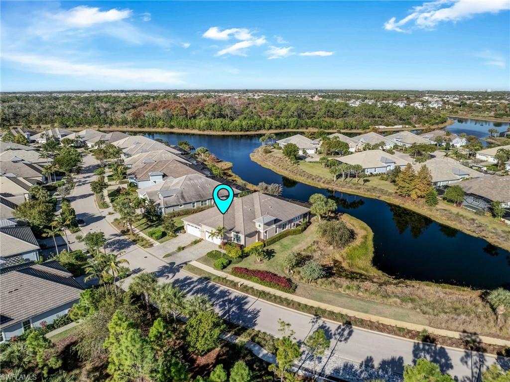7002 Dominica Drive Naples, FL 34113 - Photo 4 of 45 Aerial view of residential area featuring a nearby body of water