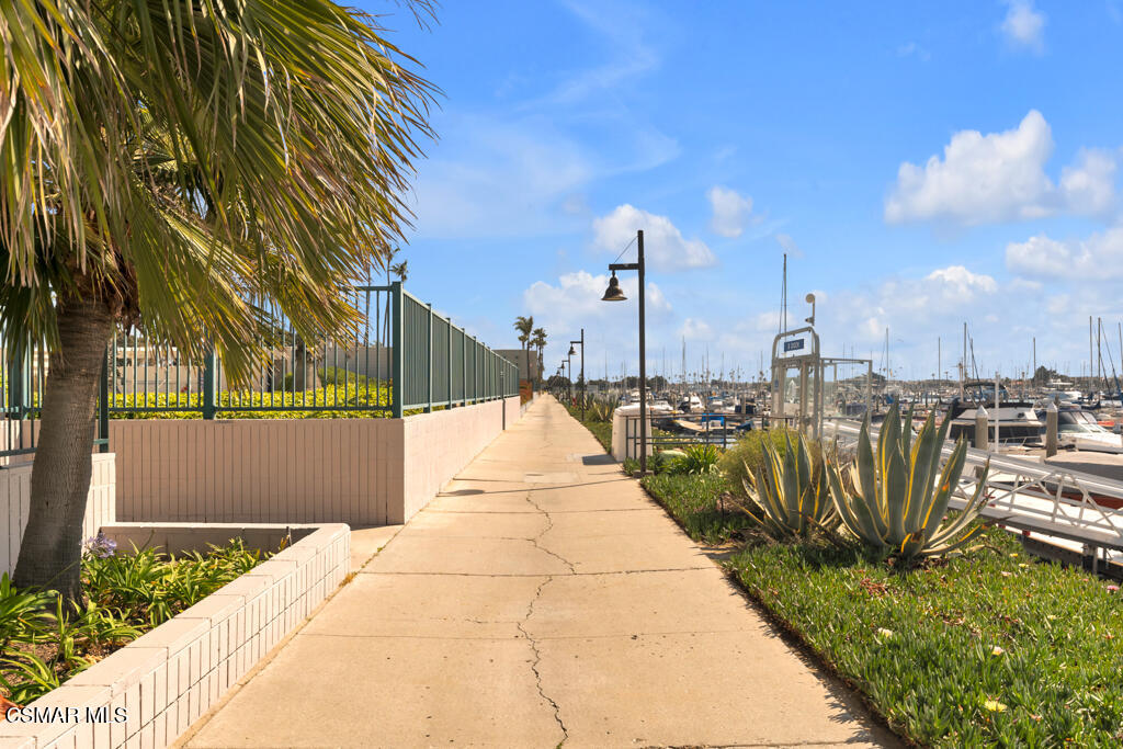 2901 Peninsula Road, Unit 137 Oxnard, CA 93035 - Photo 24 of 35 a view of a pathway with a wrought fence