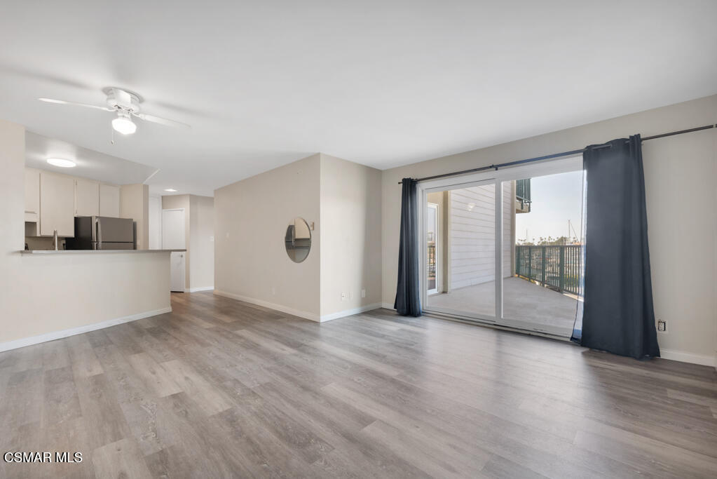 2901 Peninsula Road, Unit 137 Oxnard, CA 93035 - Photo 4 of 35 a view of a big room with wooden floor and windows
