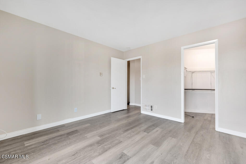 2901 Peninsula Road, Unit 137 Oxnard, CA 93035 - Photo 10 of 35 a view of an empty room with wooden floor