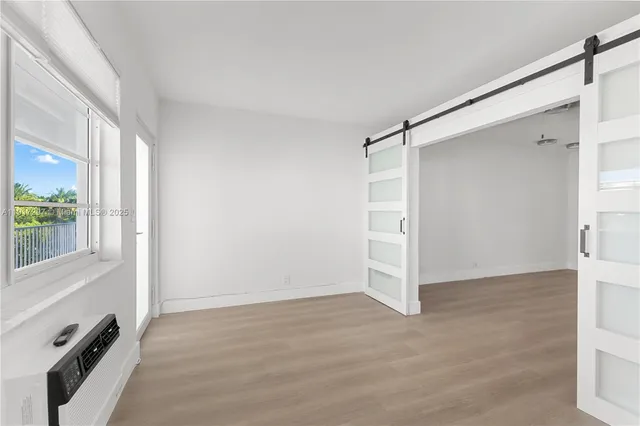 a view of an empty room with a window