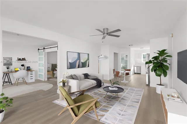 a living room with furniture and a table with wooden floor