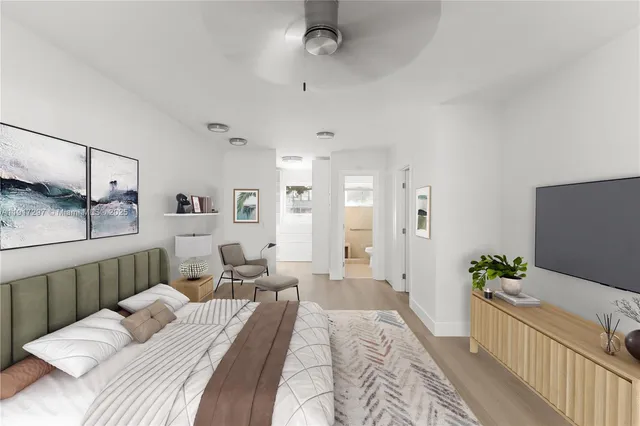 a bedroom with a bed and a couch