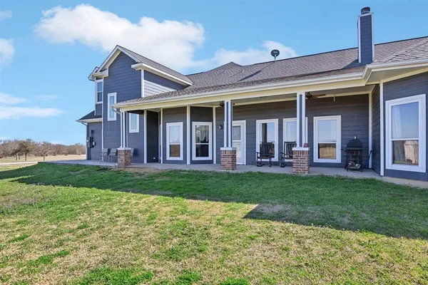 front view of a house with a yard