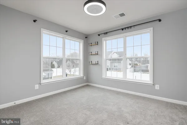 a view of an empty room with a sink