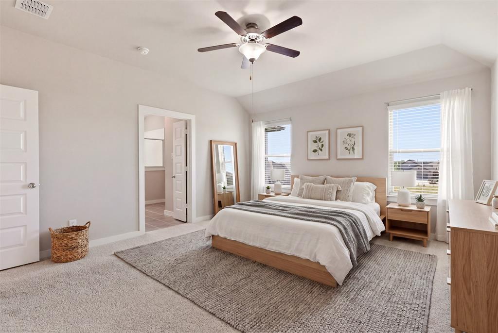 2629 Green River Road Royse City, TX 75189 - Photo 13 of 18 a spacious bedroom with a bed and a chandelier