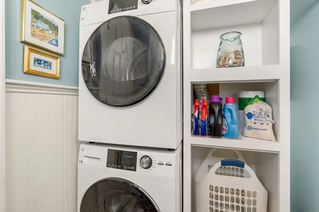 a view of a hallway with washer and dryer