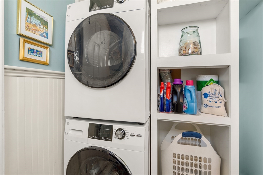60 Gregory Street, Unit 3 Marblehead, MA 01945 - Photo 13 of 42 a view of a hallway with washer and dryer