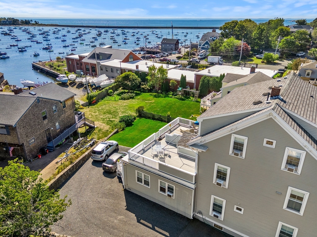 60 Gregory Street, Unit 3 Marblehead, MA 01945 - Photo 2 of 42 an aerial view of a house with yard swimming pool and outdoor seating