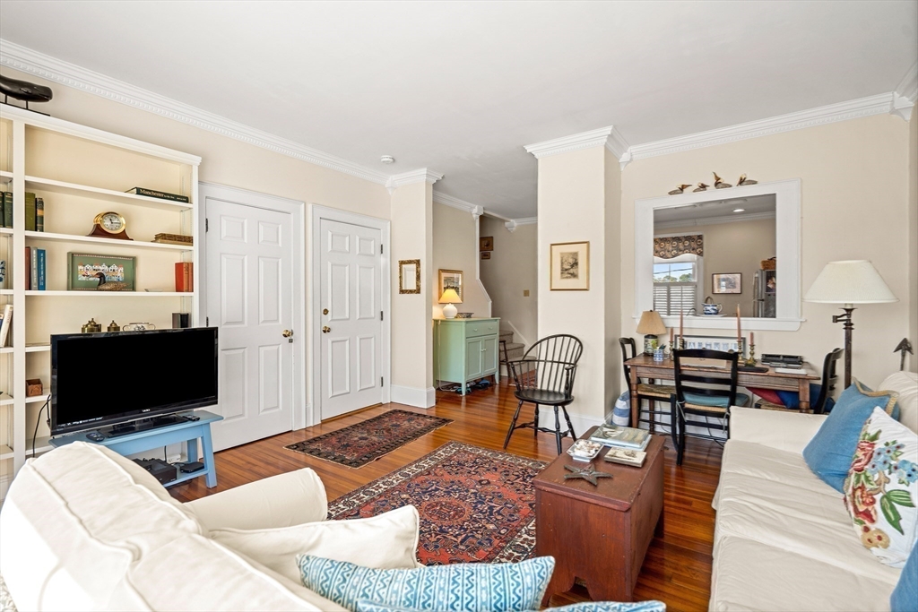 60 Gregory Street, Unit 3 Marblehead, MA 01945 - Photo 34 of 42 a living room with furniture and a flat screen tv