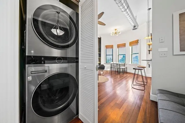 a view of a livingroom with furniture and wooden floor