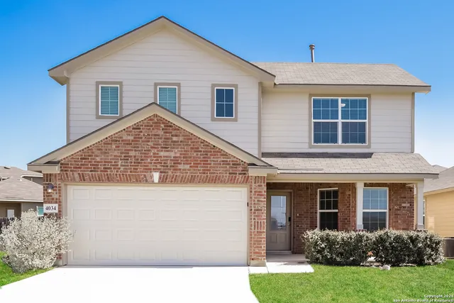 a view of house with yard